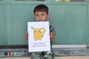"Soy de Kafranbel, sálvame" se lee en la pancarta