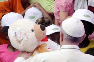 Pope Francis is presented with a plush toy from refugees as he leads the weekly audience in Paul VI hall at the Vatican August 3, 2016. REUTERS/Max Rossi